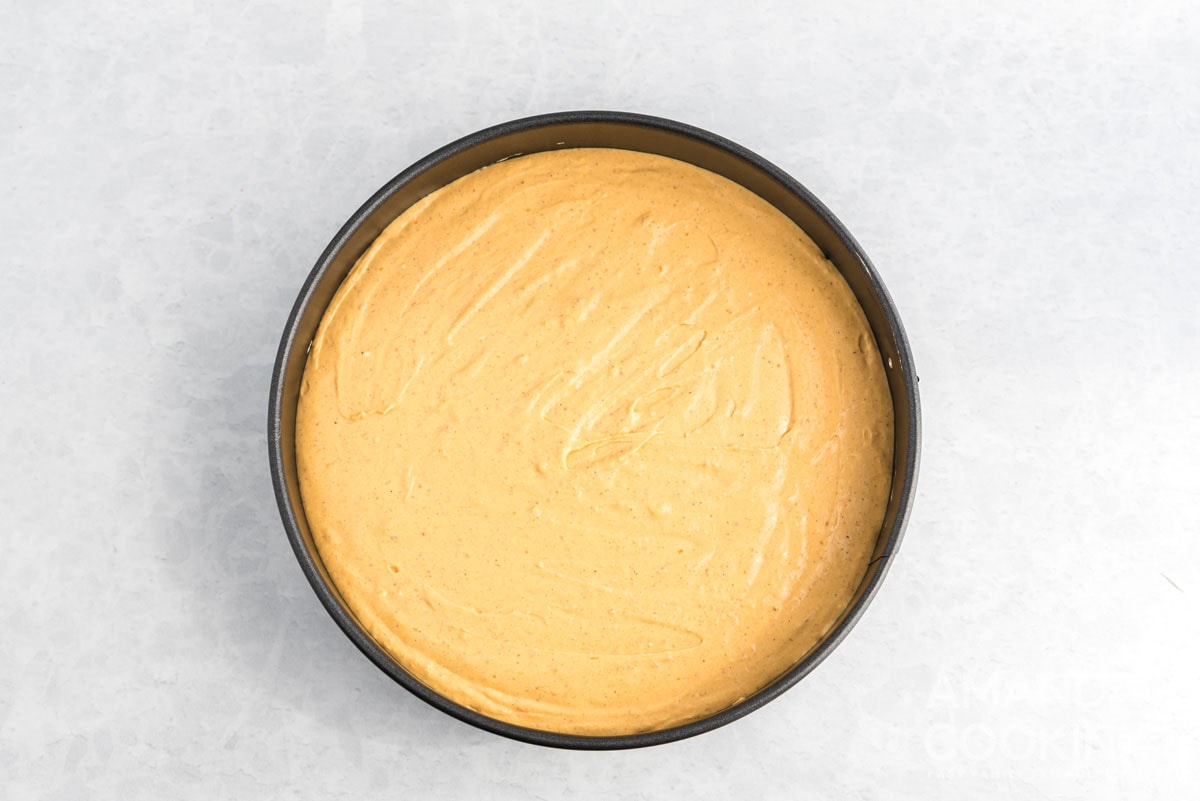 pumpkin cheesecake batter in pan