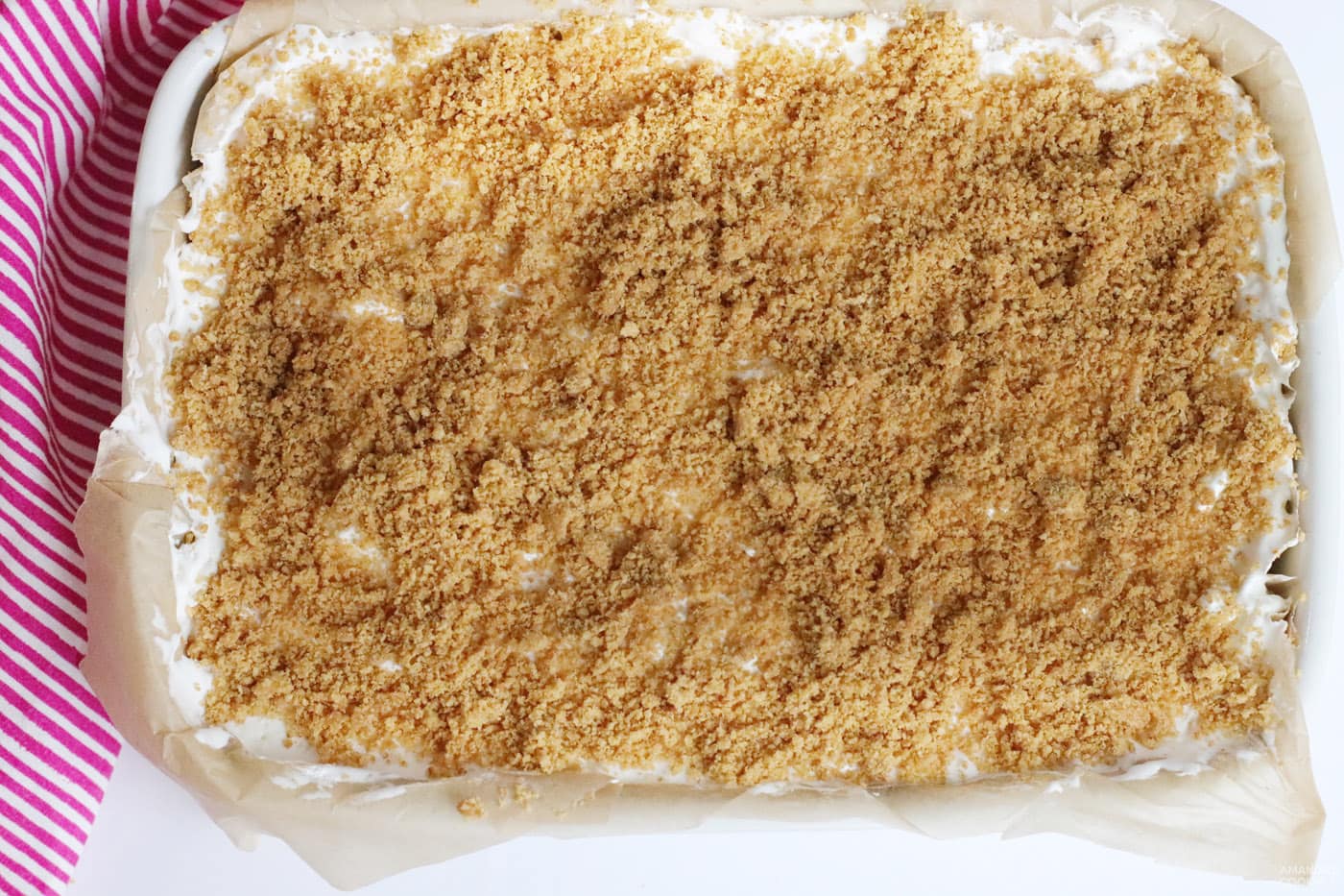 graham cracker topping on strawberry cheesecake bars