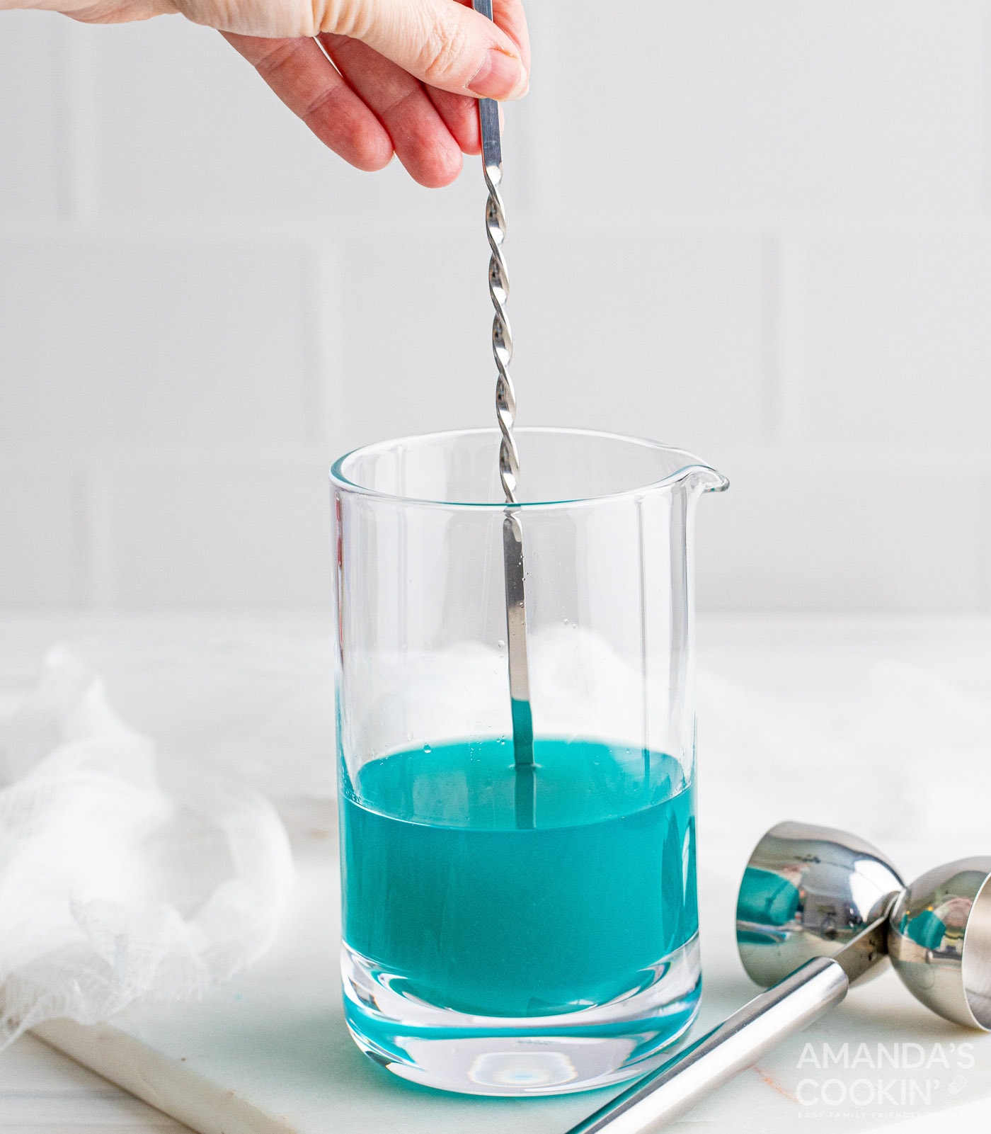 mixing liquor in a glass