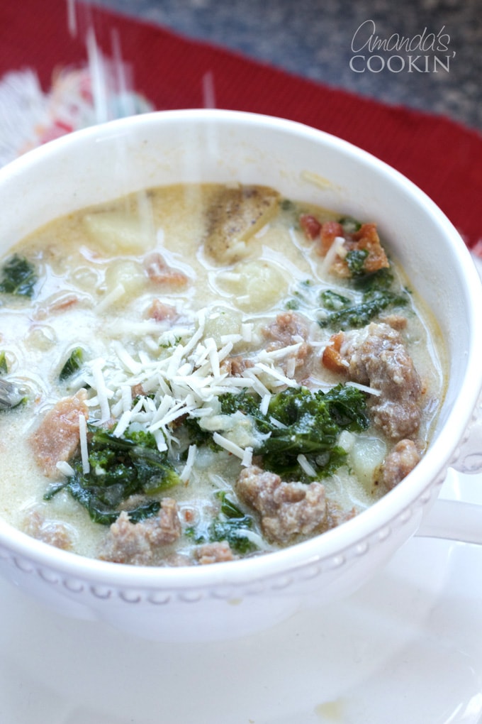 cheese being added to soup