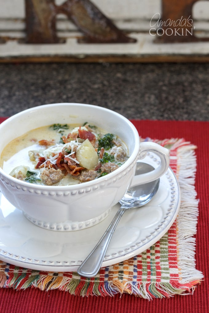 bowl of zuppa toscana on red placemat