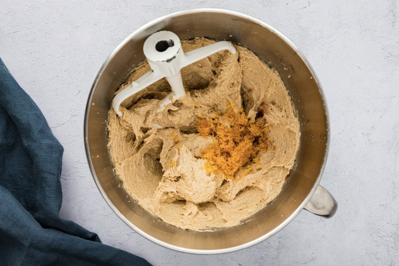 orange zest added to dough in a stand mixer bowl
