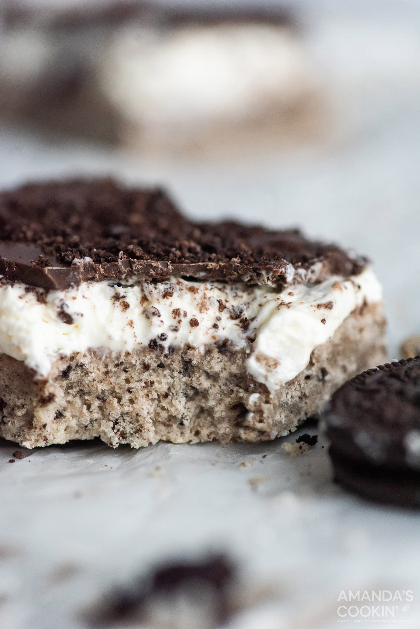 oreo cheesecake bar with a bite out of it