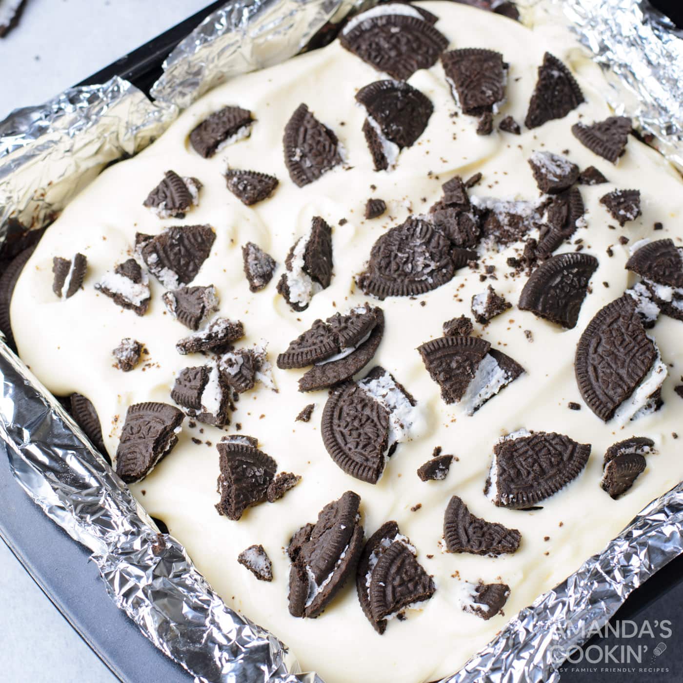 crushed Oreos over the top of cheesecake