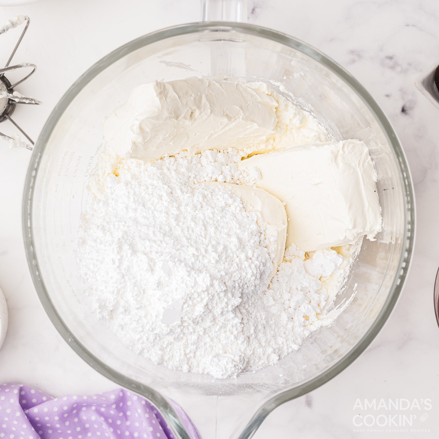 cream cheese with powdered sugar in a bowl