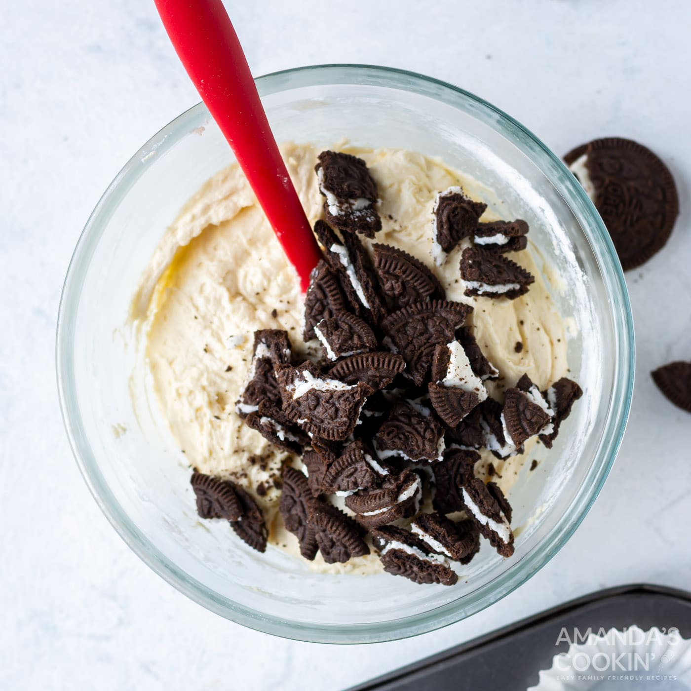 cupcake batter with crushed oreos in a mixing bowl