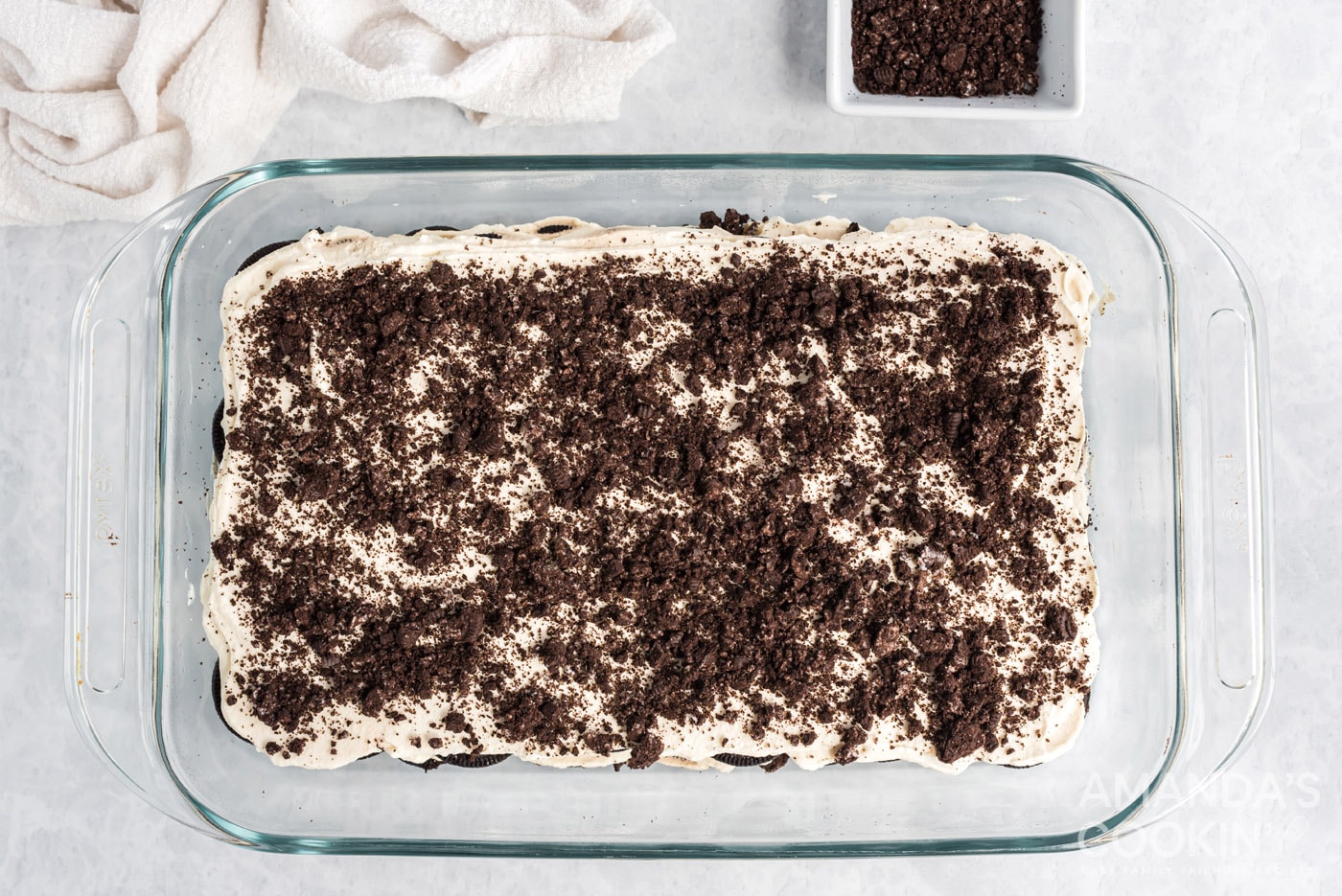 crushed Oreos on top of oreo icebox cake