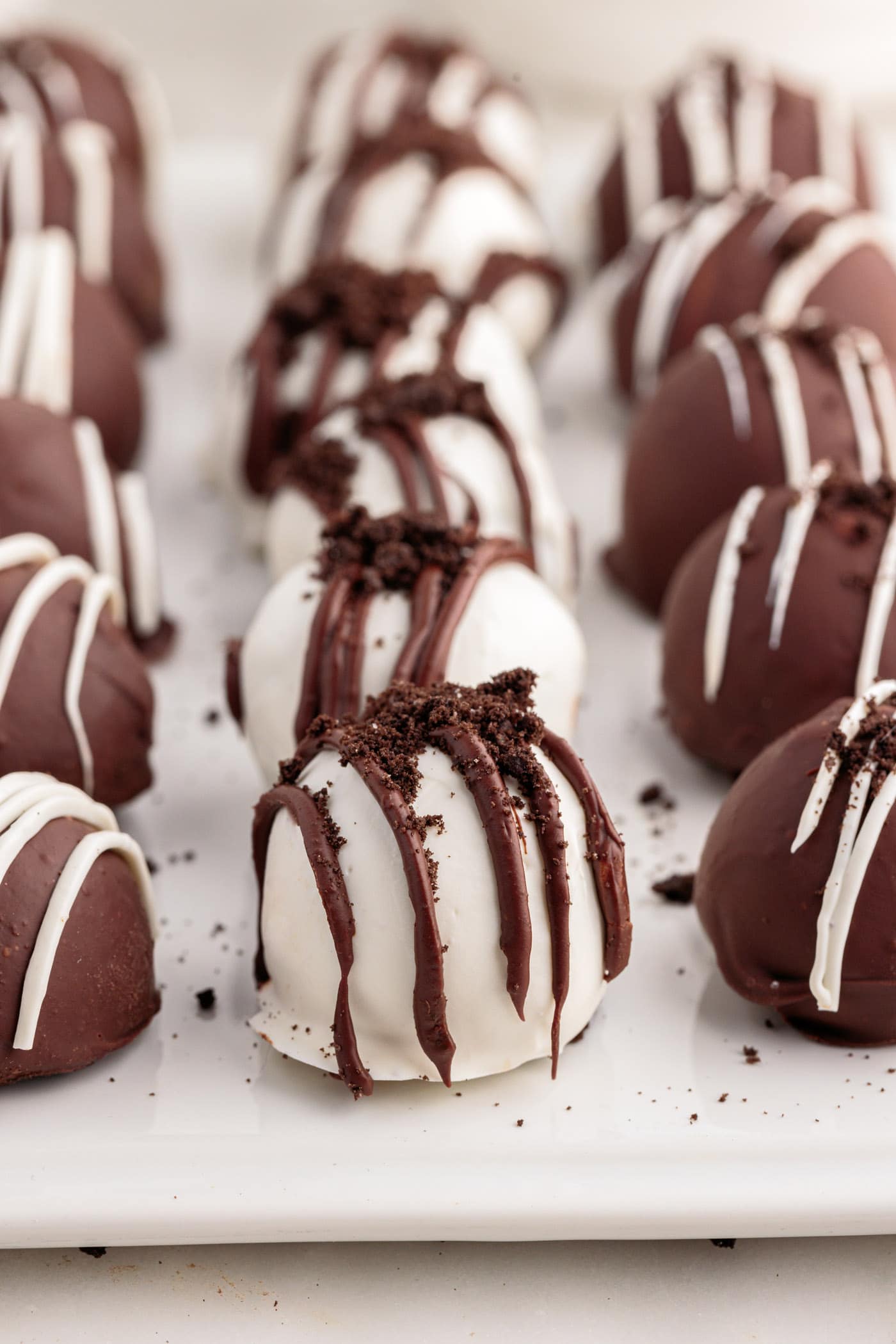 Oreo Truffles lined on on a tray with parchment paper