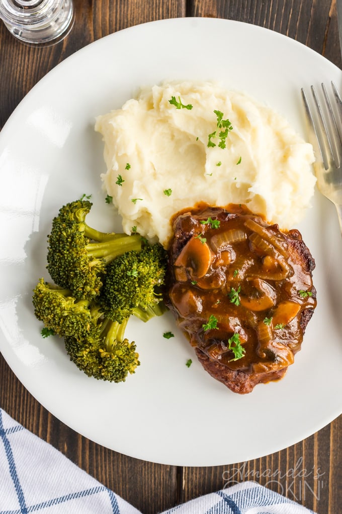 A plate of Swiss steak with broccoli