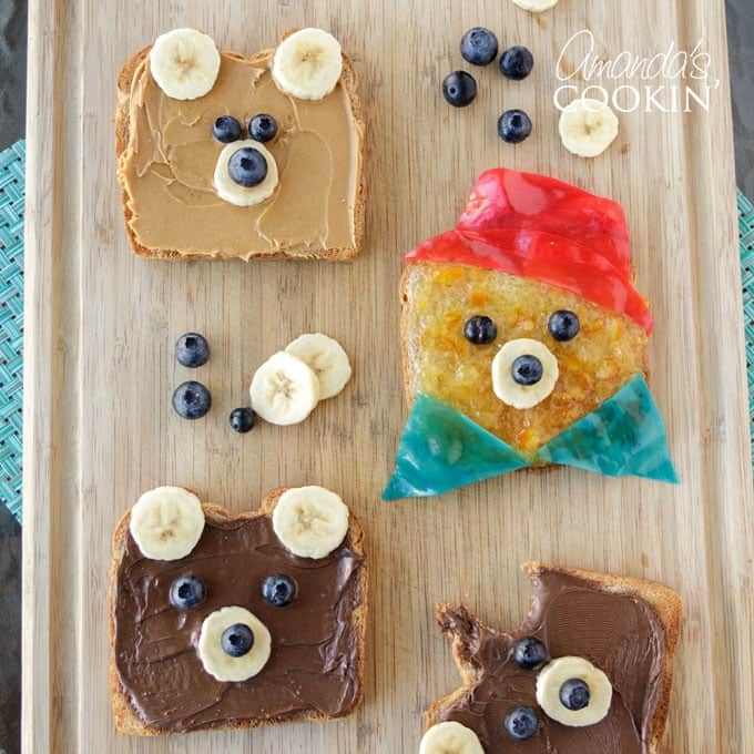 toast decorated to look like paddington bear on a cutting board