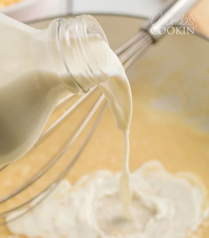milk bottle pouring into skillet