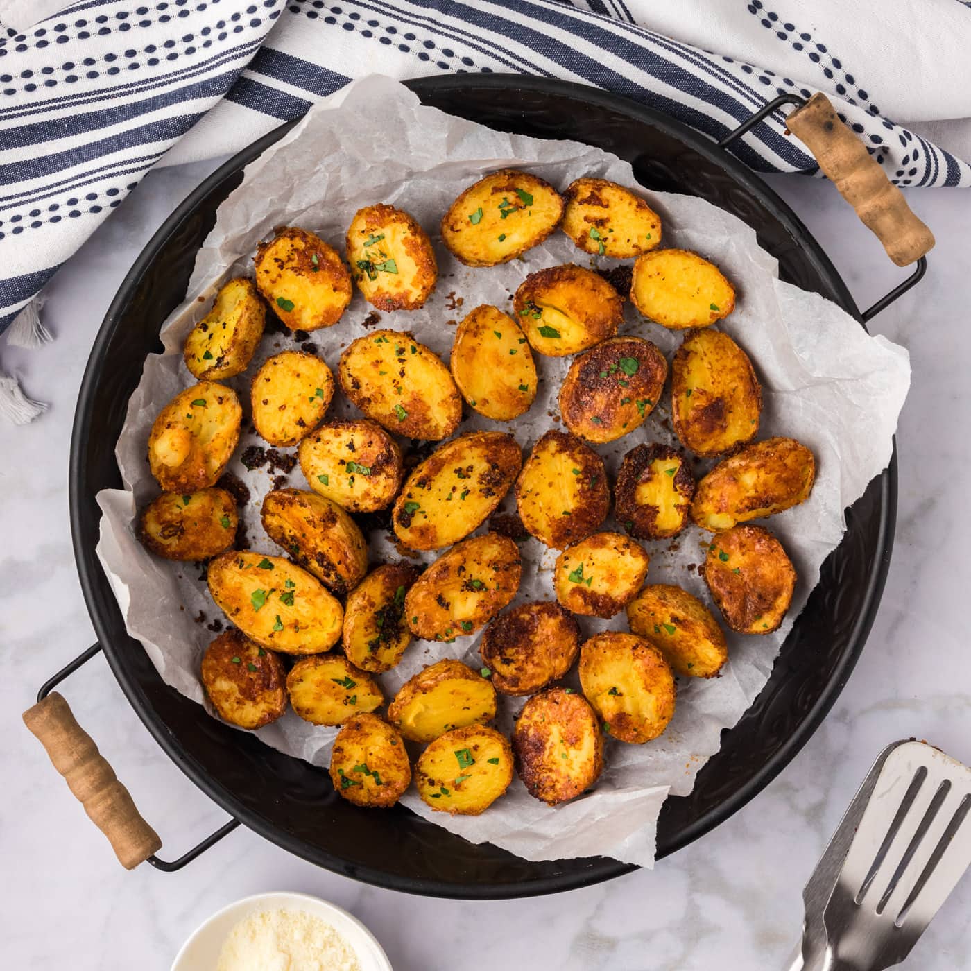 Parmesan Potatoes in a metal serving tray