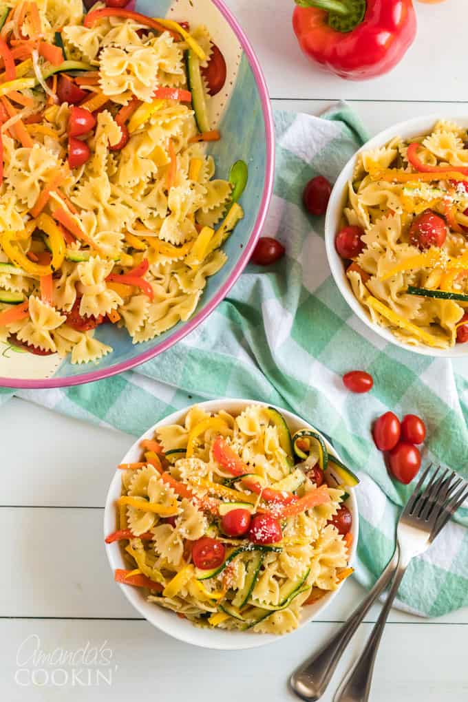 two bowls of pasta primavera on a table