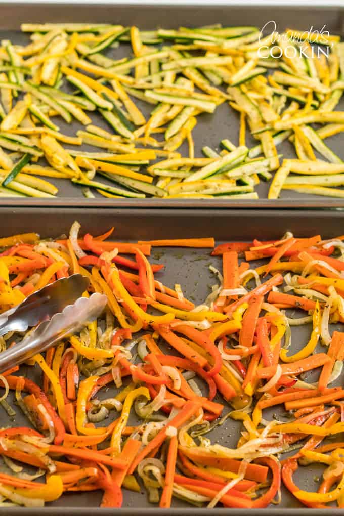 rongs picking up roasted vegetables off pan