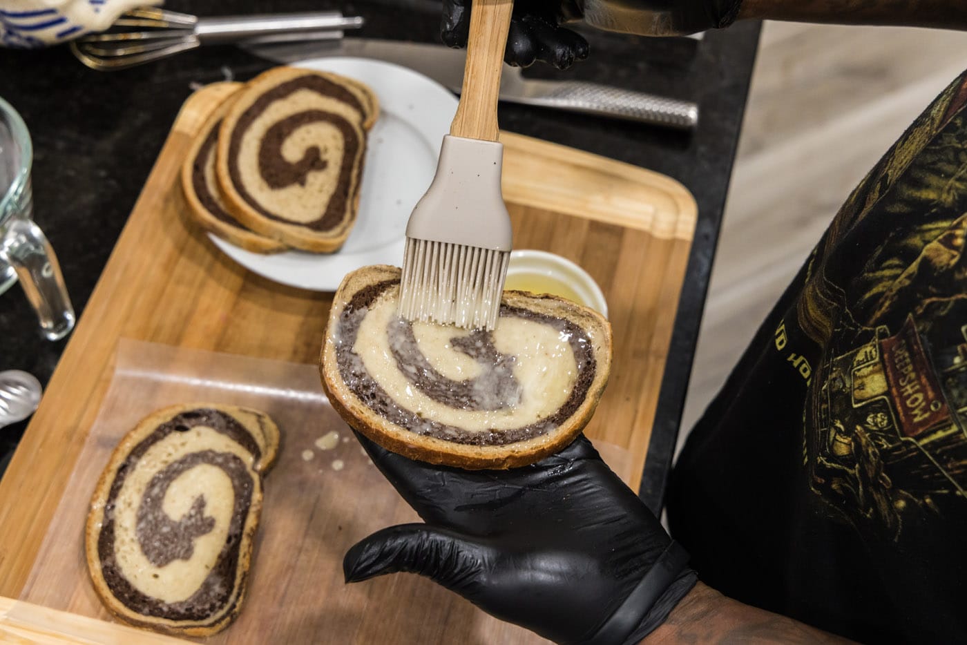 brushing butter on rye bread