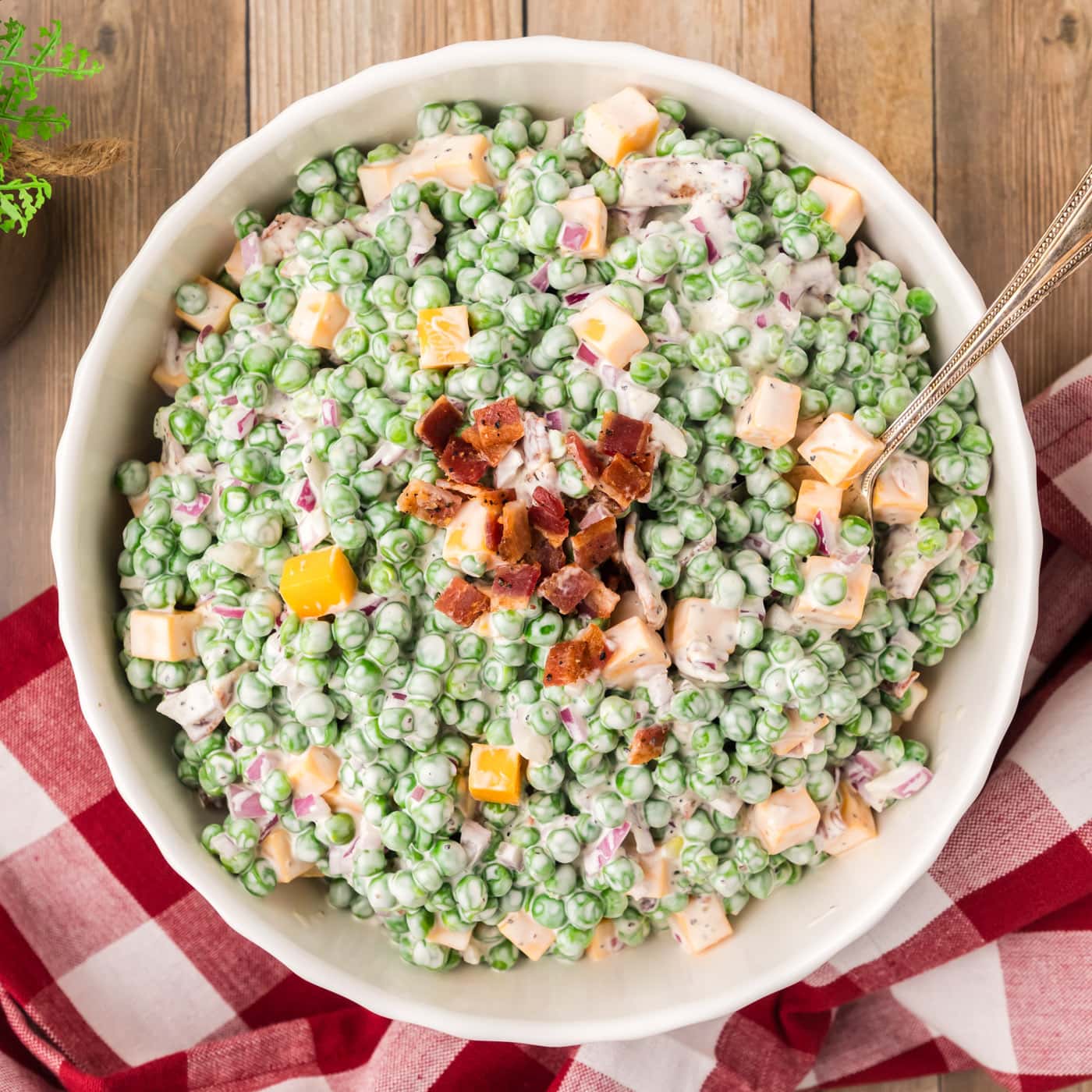 Overhead photo of Pea Salad topped with chopped bacon