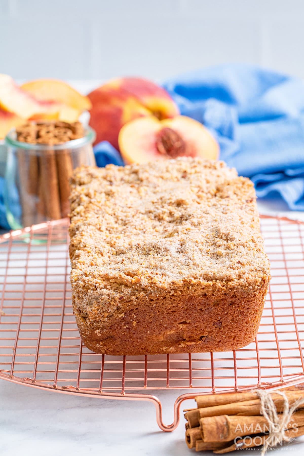 loaf of peach bread on a cooling rack