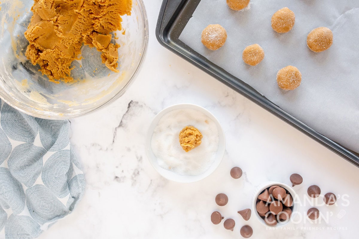 cookie dough balls on baking sheet