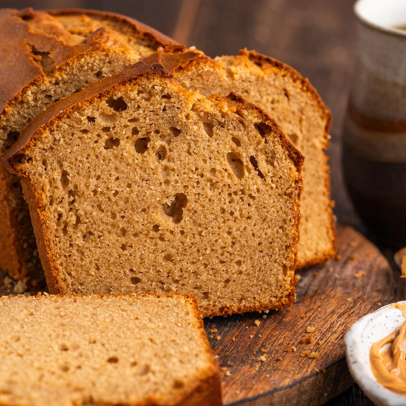 Close up photo of a loaf of Peanut Butter Bread cut into slices