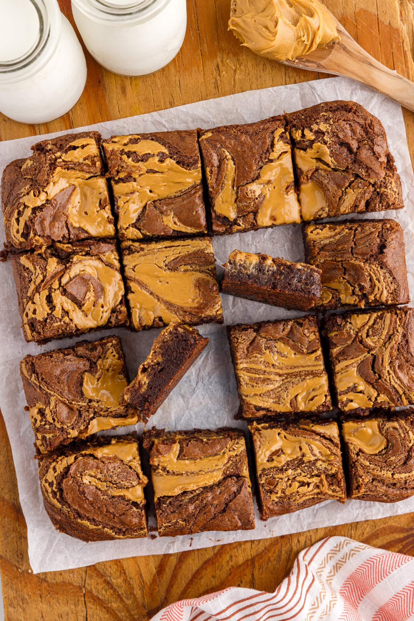 Pan of Peanut Butter Brownies cut up on a wooden platter