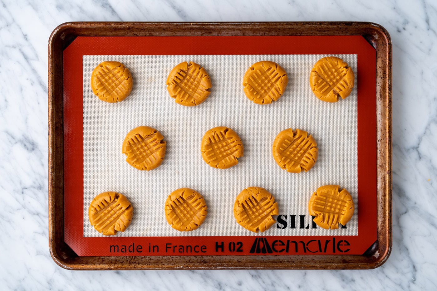 peanut butter cookie dough on a baking sheet