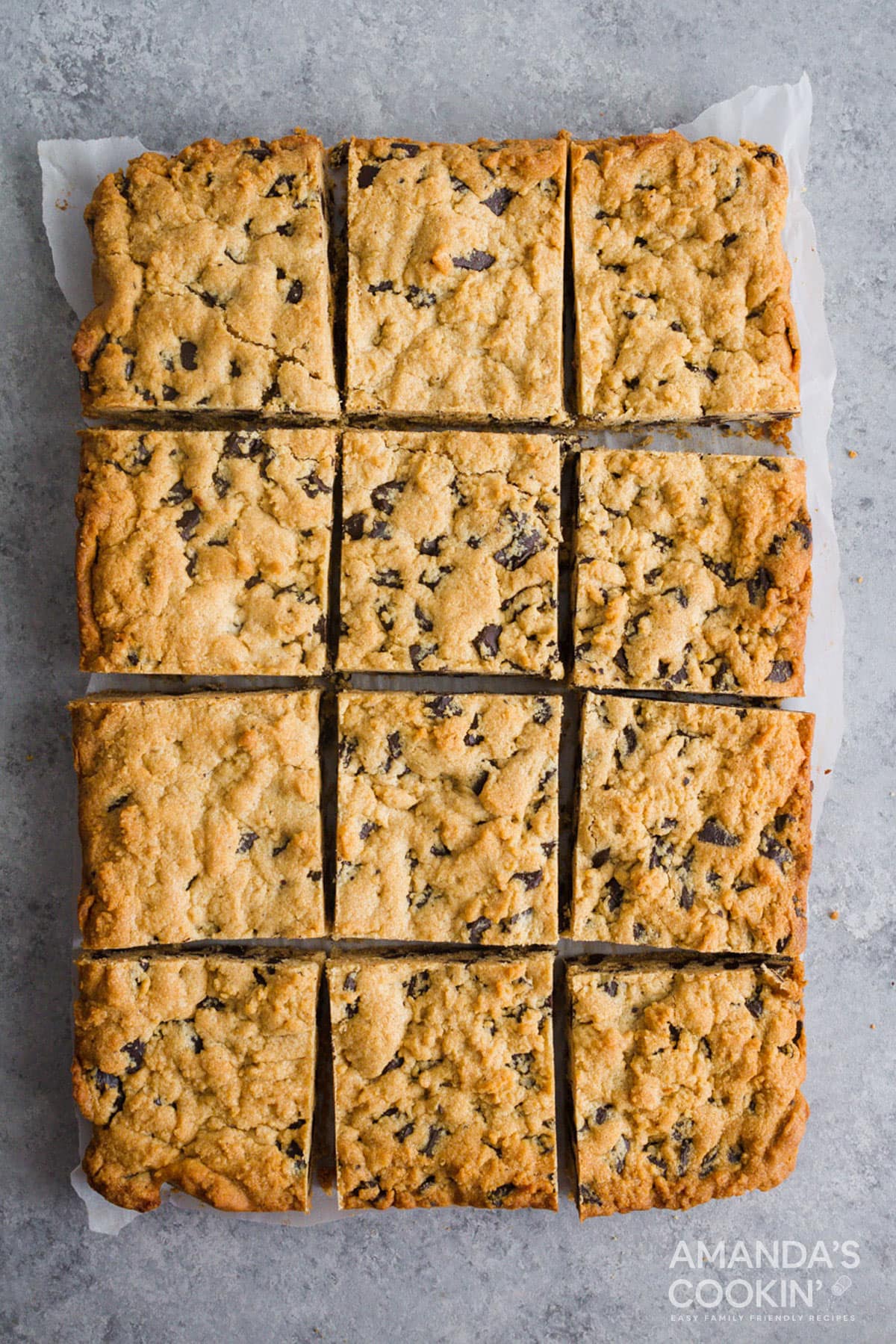 overhead view of peanut butter chocolate chunk bars on parchment paper