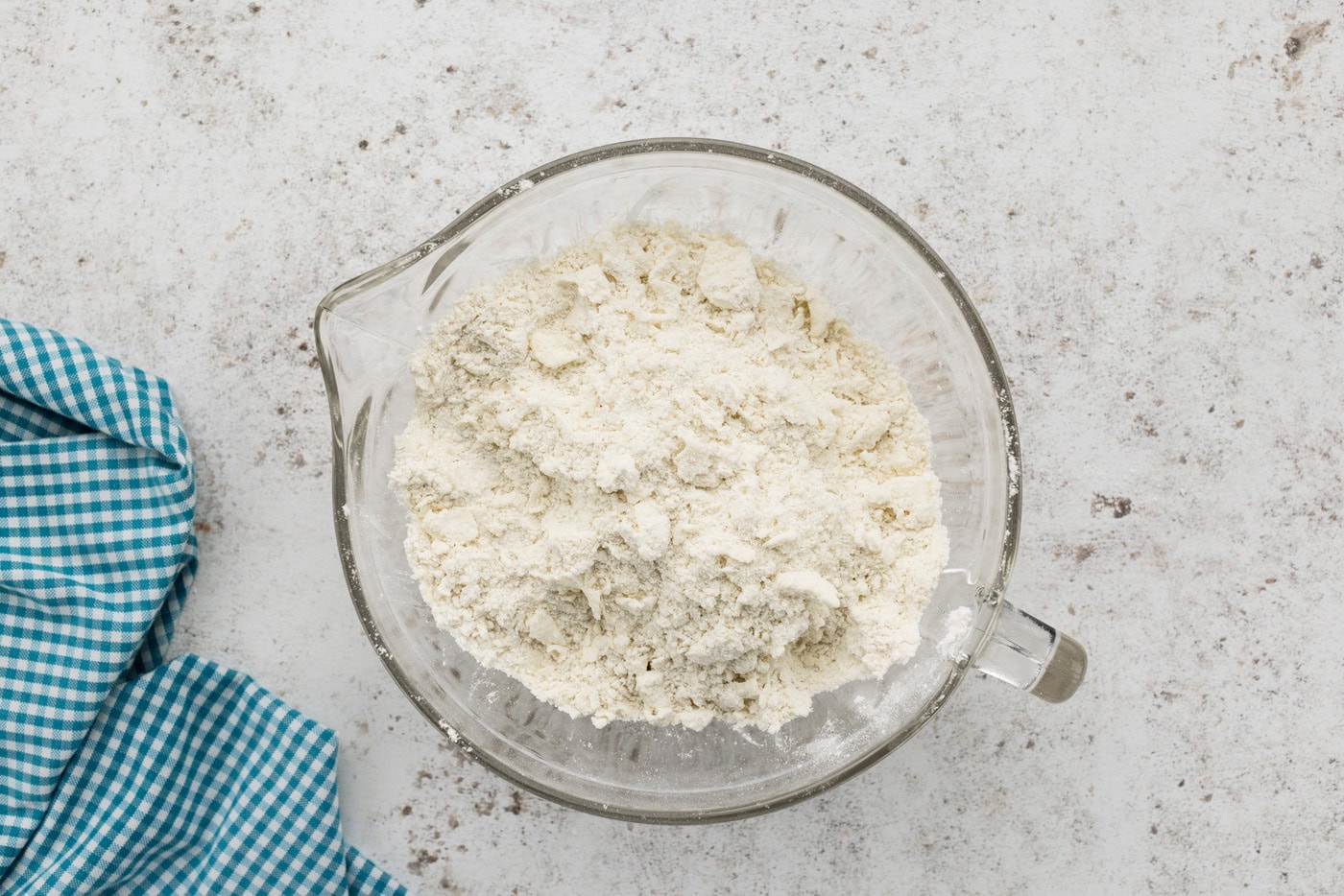 coarse crumbed shortbread mixture in a mixing bowl