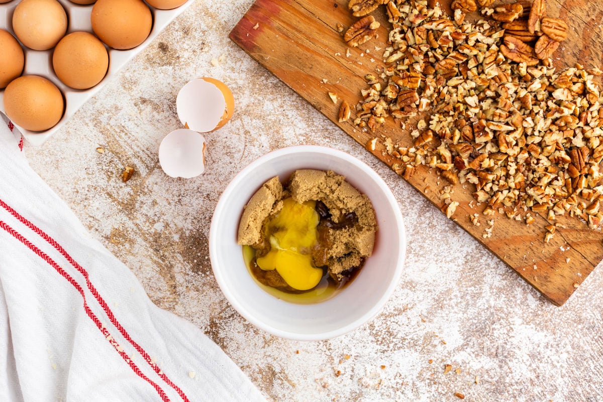 egg in a bowl with brown sugar