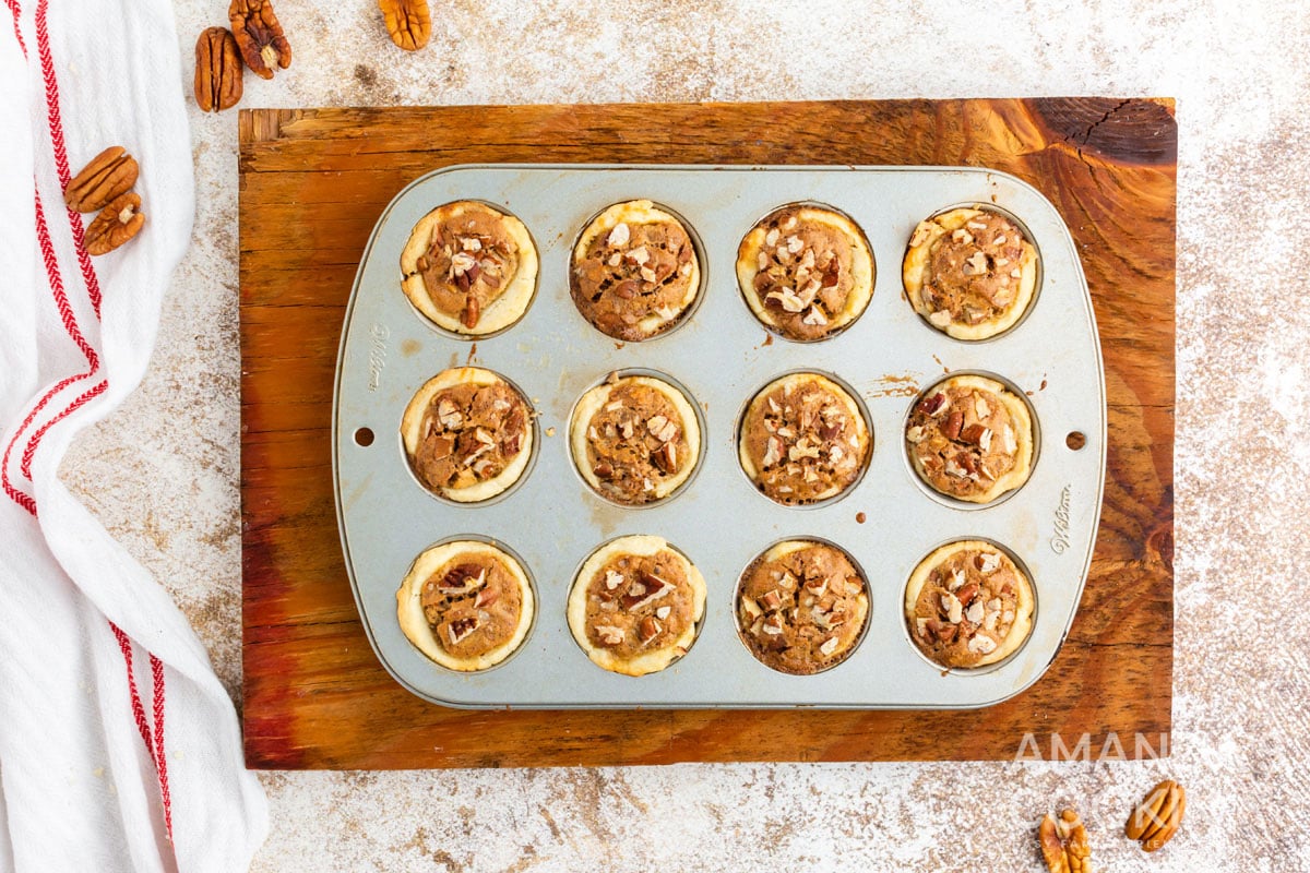 baked pecan tassies in a mini muffin tin