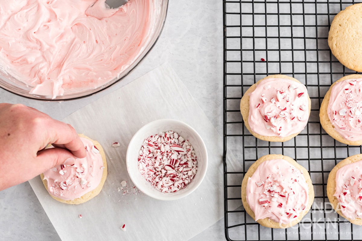 sprinkling cookies with crushed candy canes