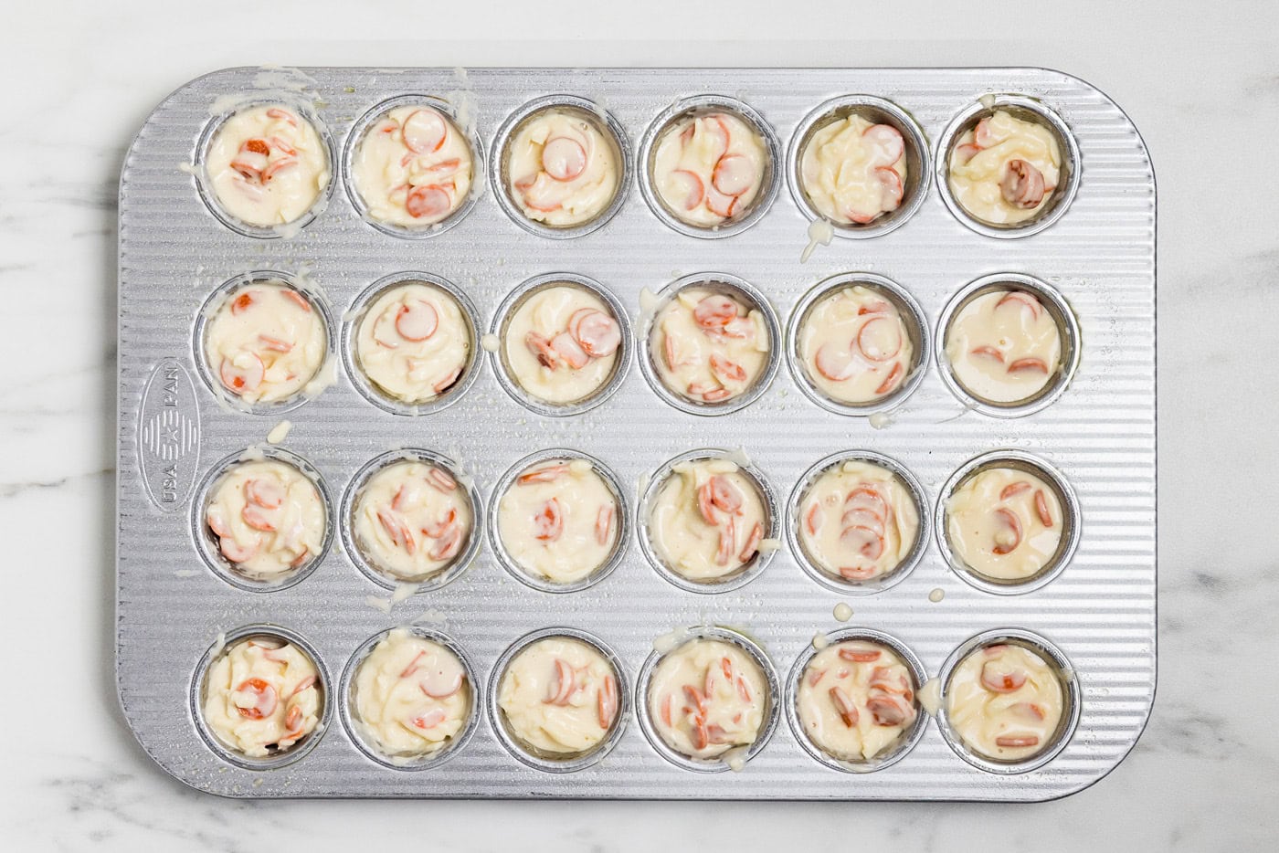 Pepperoni Pizza Puffs batter in mini muffin tin