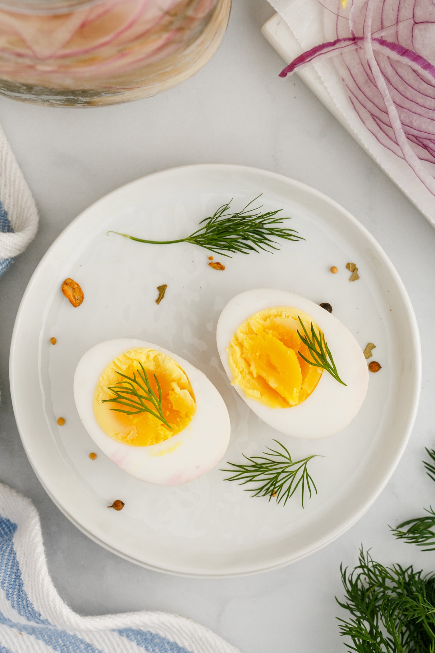 A Pickled Egg cut in half on a plate