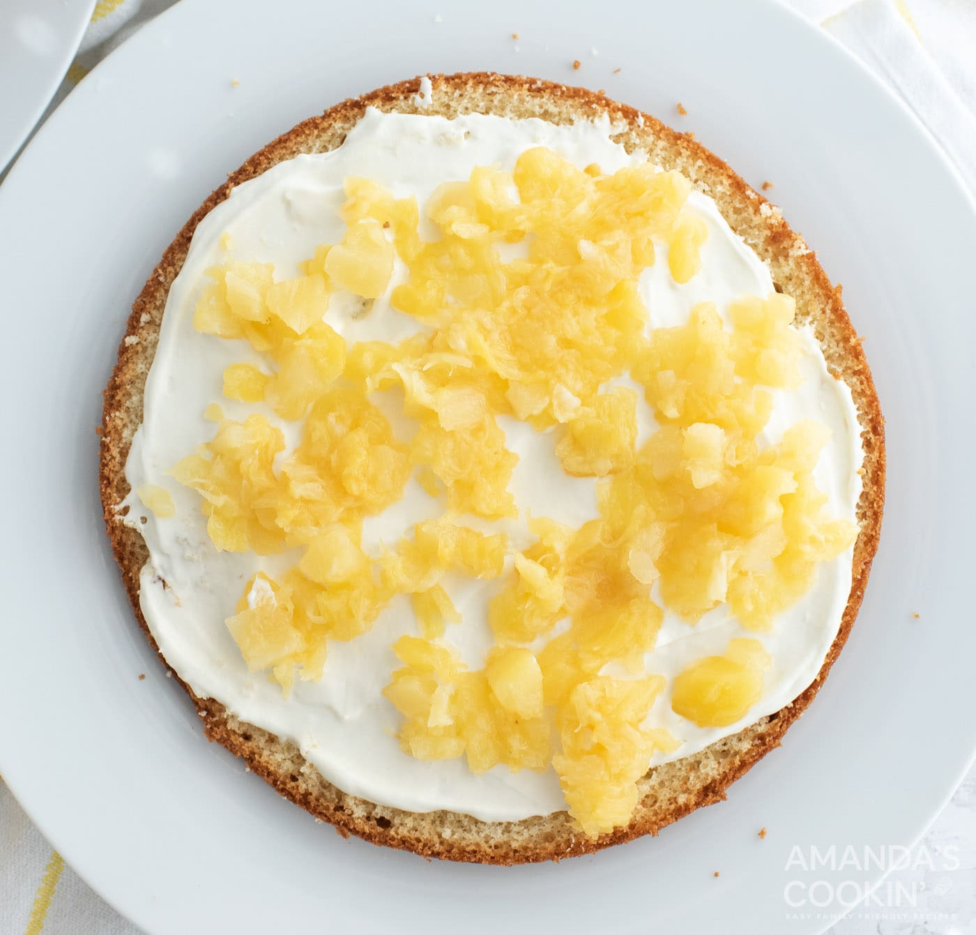 pineapple chunks on top of frosting and cake