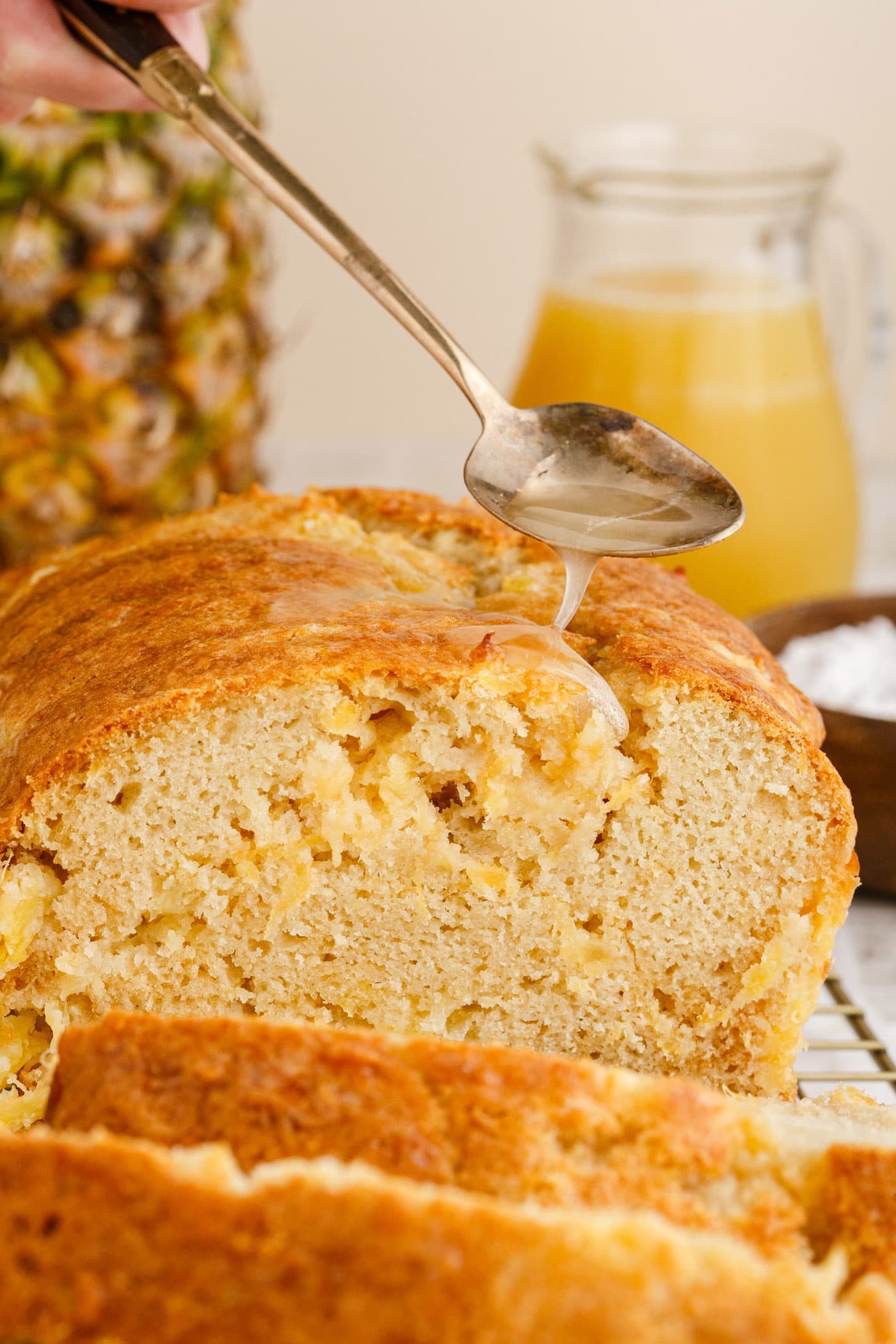 drizzling sauce on Pineapple Quick Bread