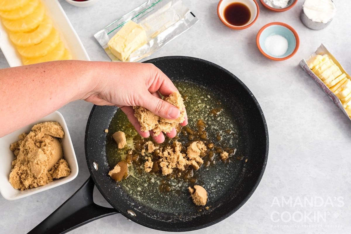 adding brown sugar to skillet