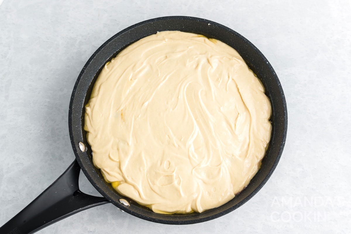 cake batter in cast iron skillet