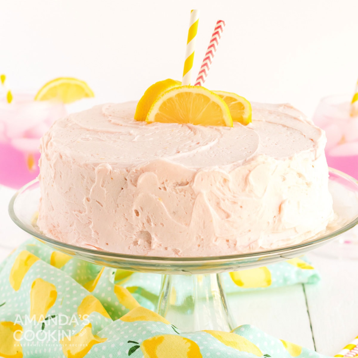 pink lemonade cake on a cake plate