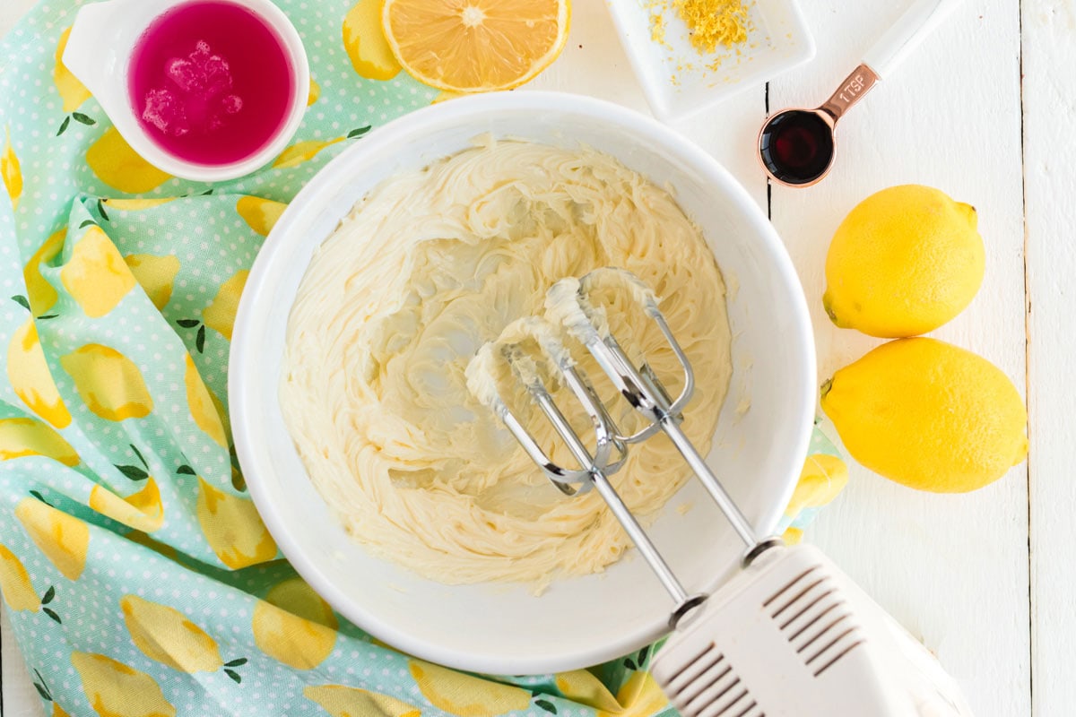 beating butter in a bowl with a mixer