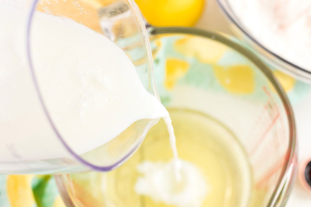 adding buttermilk to a bowl