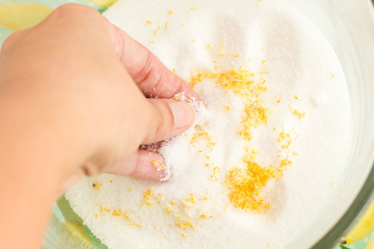 rubbing lemon zest into sugar