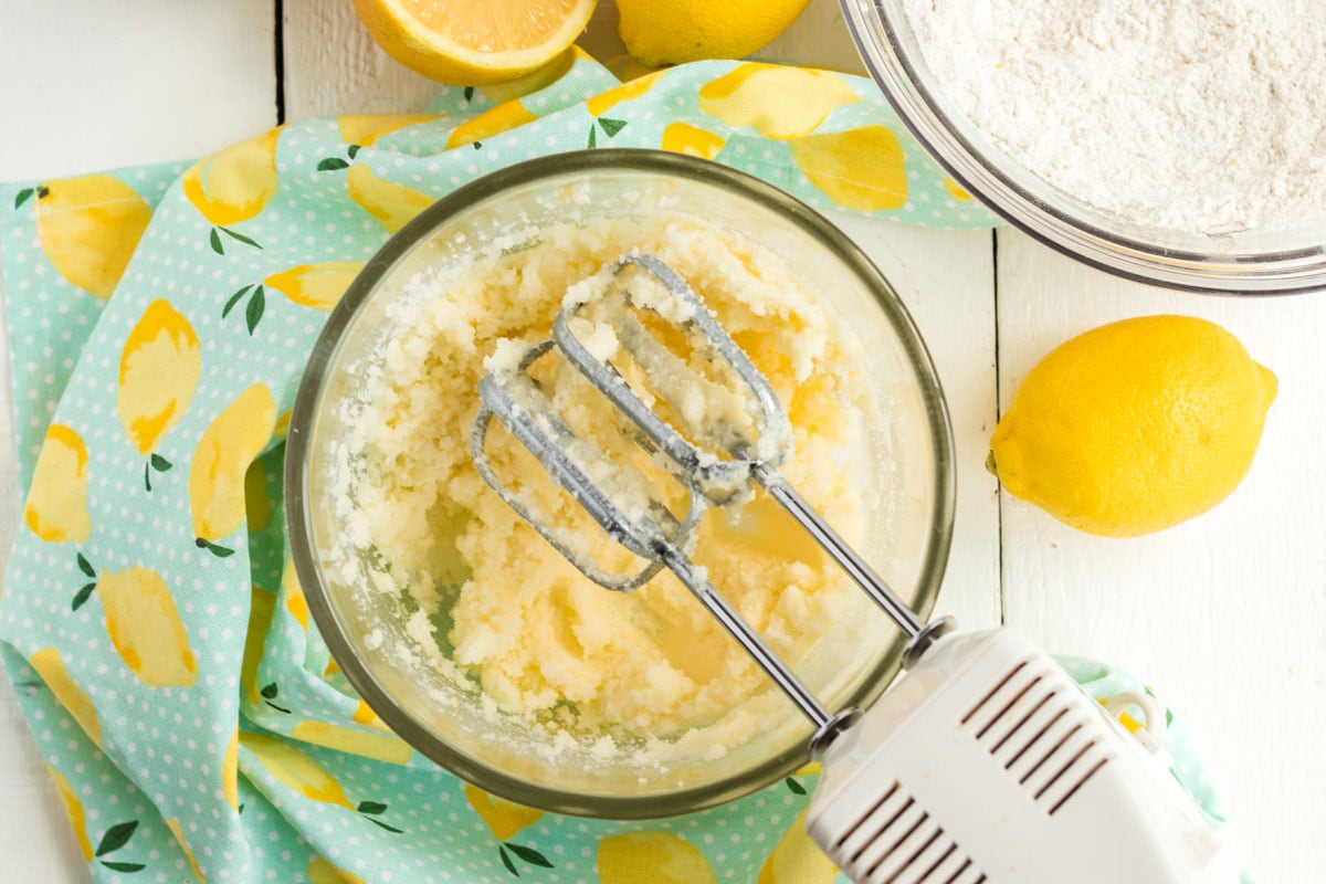mixing sugar and butter in a bowl