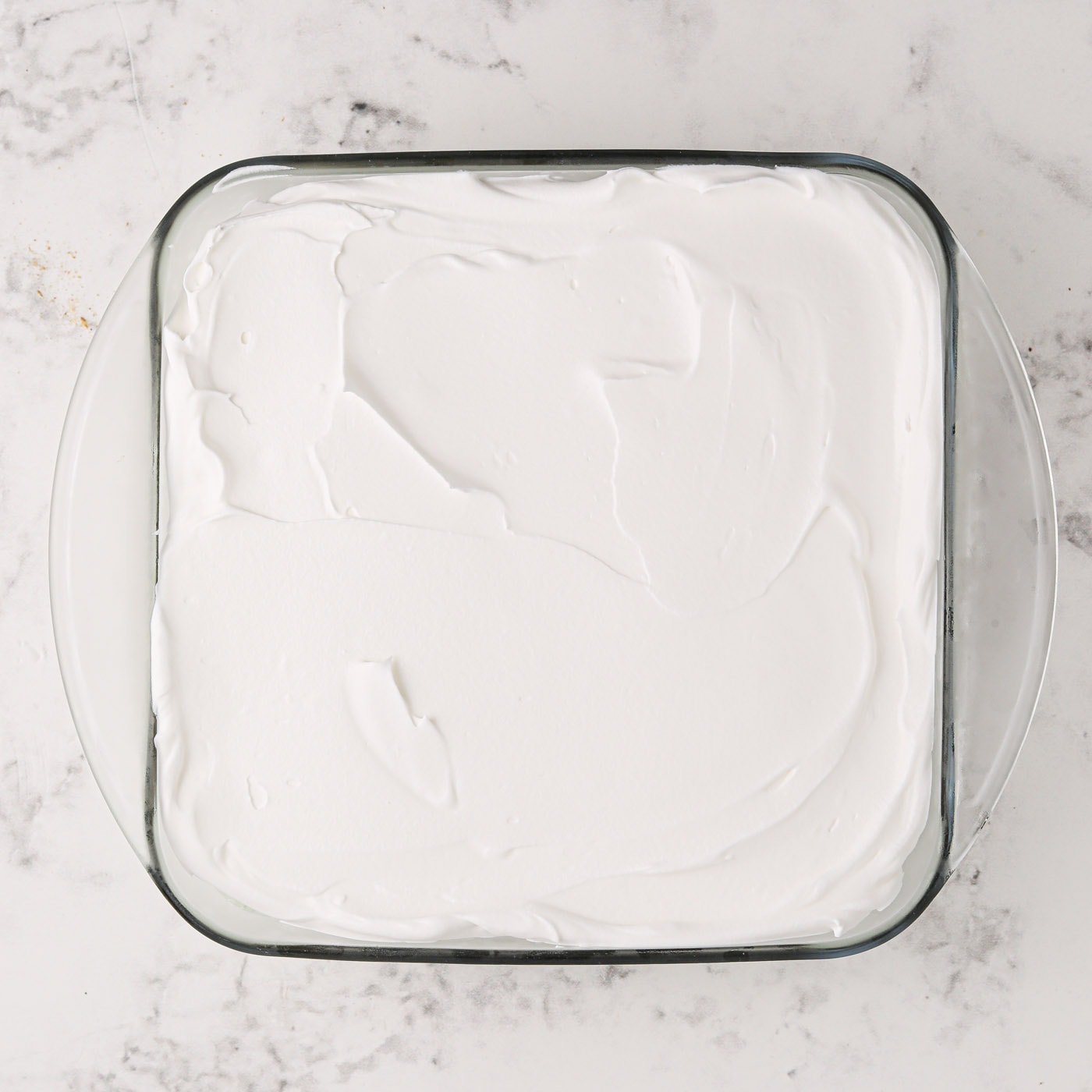 whipped topping overtop pistachio ice cream