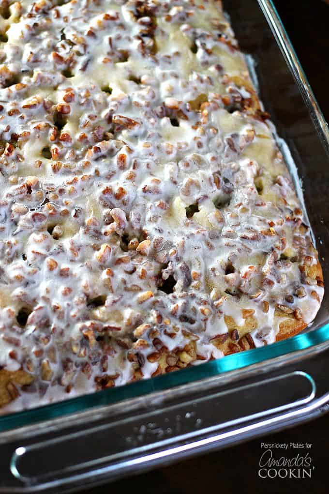 Overhead close up photo of Pistachio Poke Cake in a glass pan