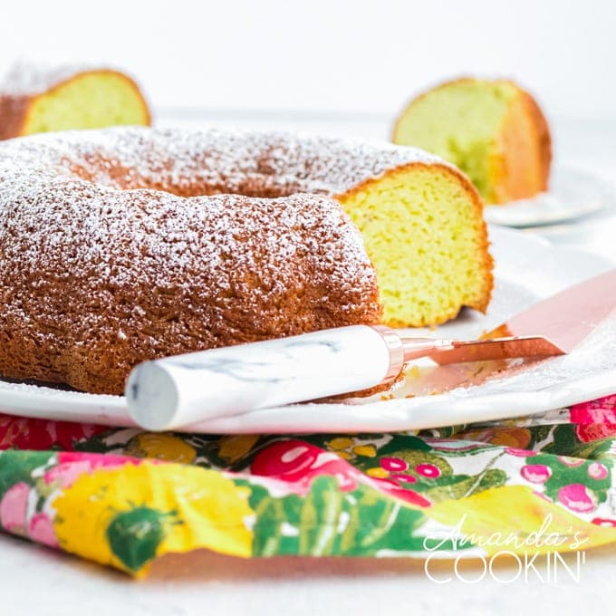 pistachio bundt cake with a slice removed