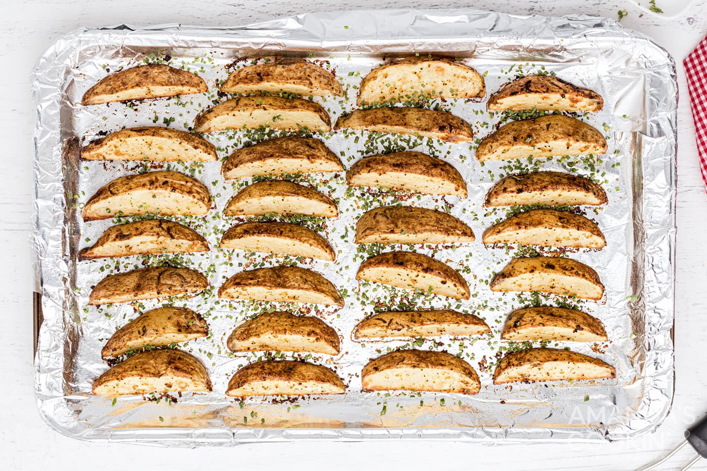 roasted potato wedges on baking sheet