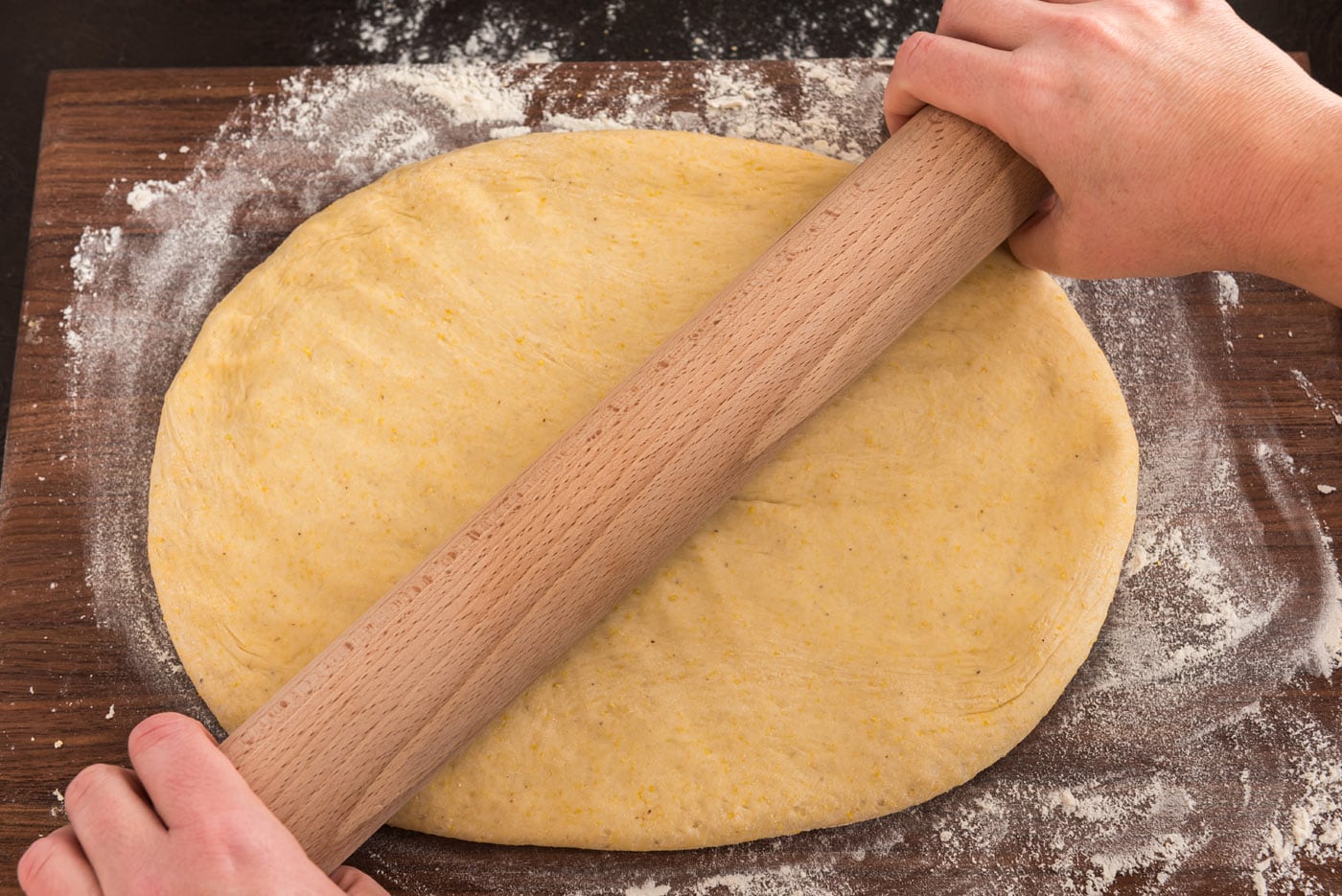 rolling dough into a large rectangle