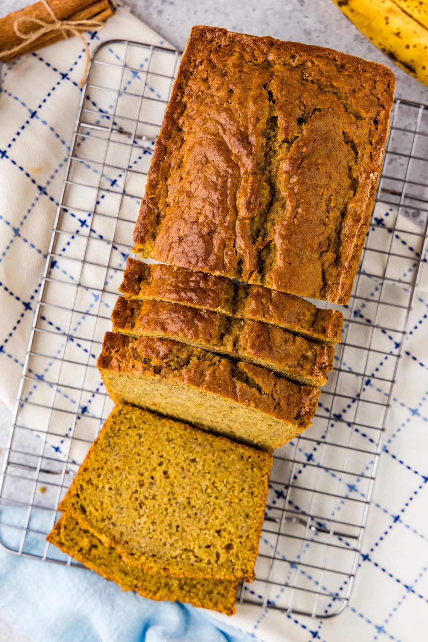 Pumpkin Banana Bread cut into slices on a wire rack