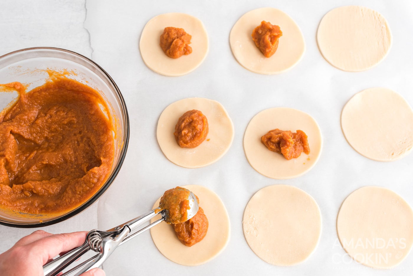 pumpkin pie filling on top of dough discs