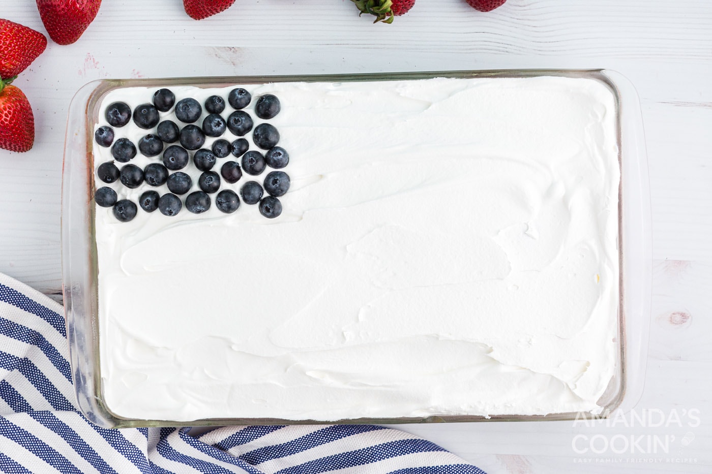 blueberries on top left corner of cake