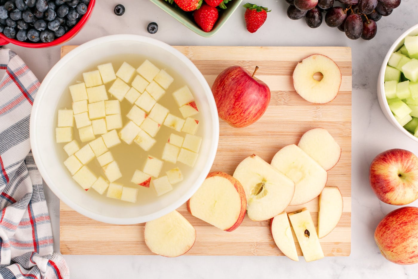 chopped apples soaking in lemon juice water mixture